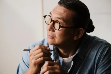 Man thinking while holding reMarkable Marker